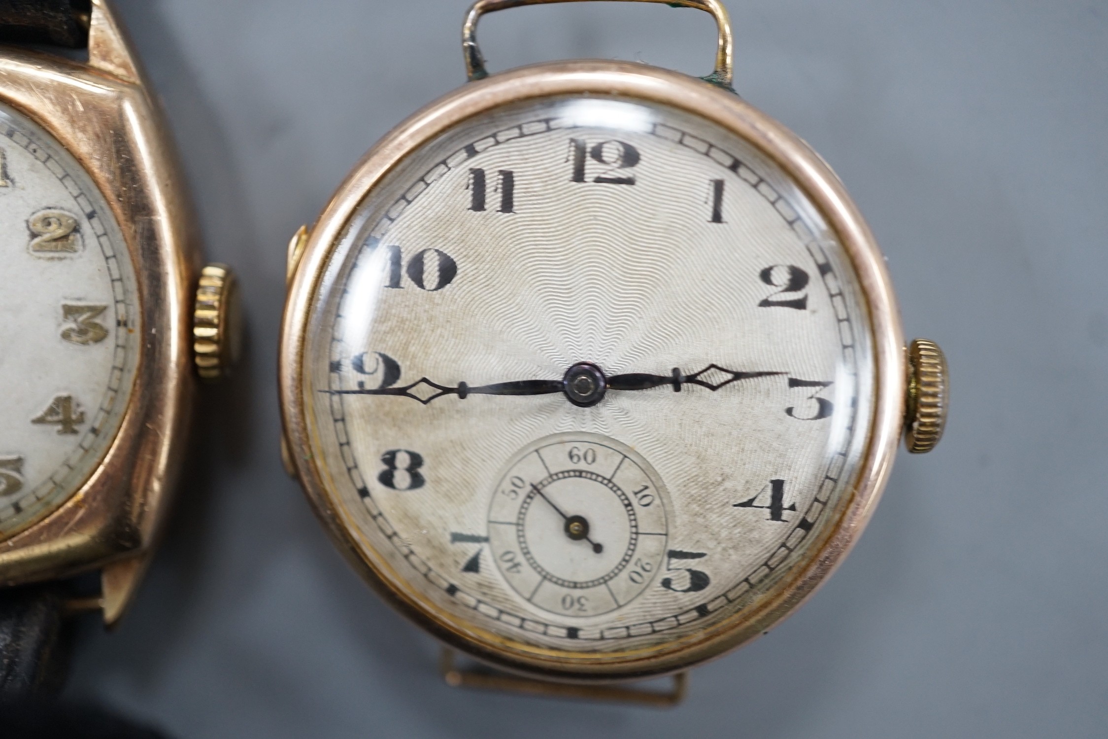 A gentleman's 1930's 9ct gold manual wind wrist watch (no strap), with case back inscription and one other gentleman's yellow metal manual wind wrist watch.
